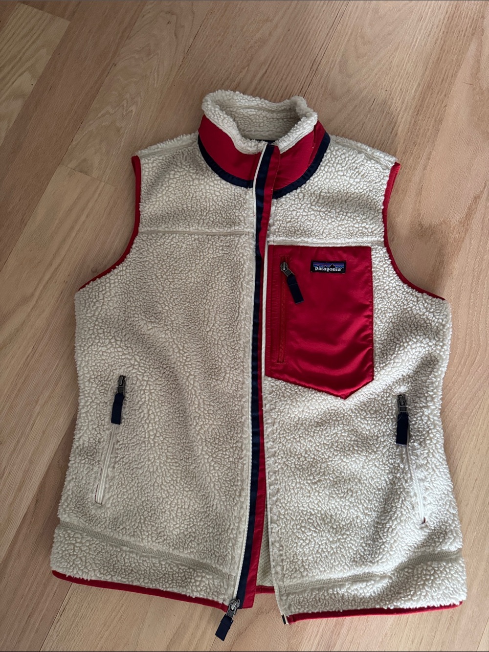 Patagonia women’s Cream Sherpa Vest with Red Chest Pocket